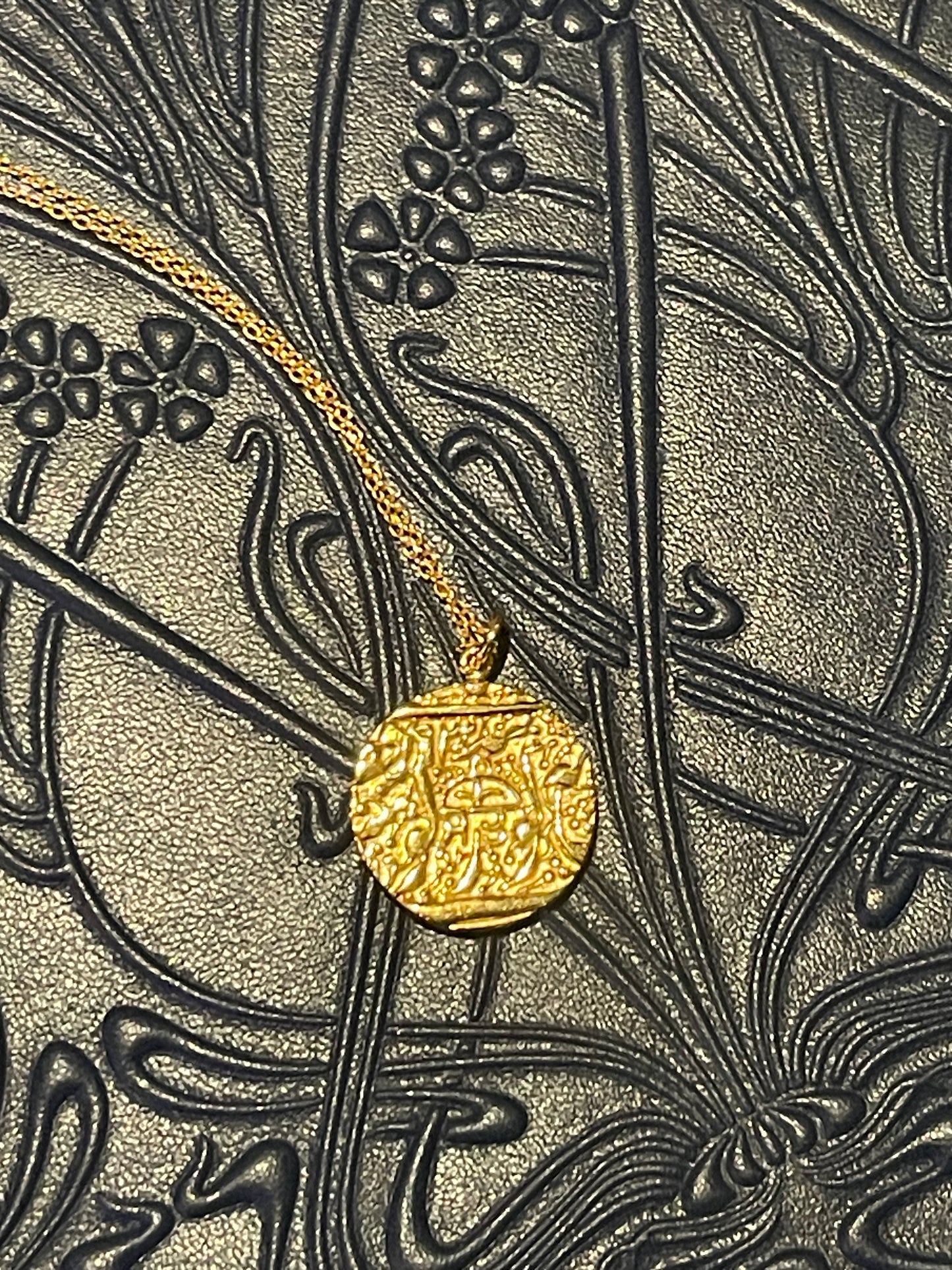 Sohavi Gold Truth coin necklace on a textured Liberty design with intricate patterns on Wolf 1984 Luxury Jewellery box
