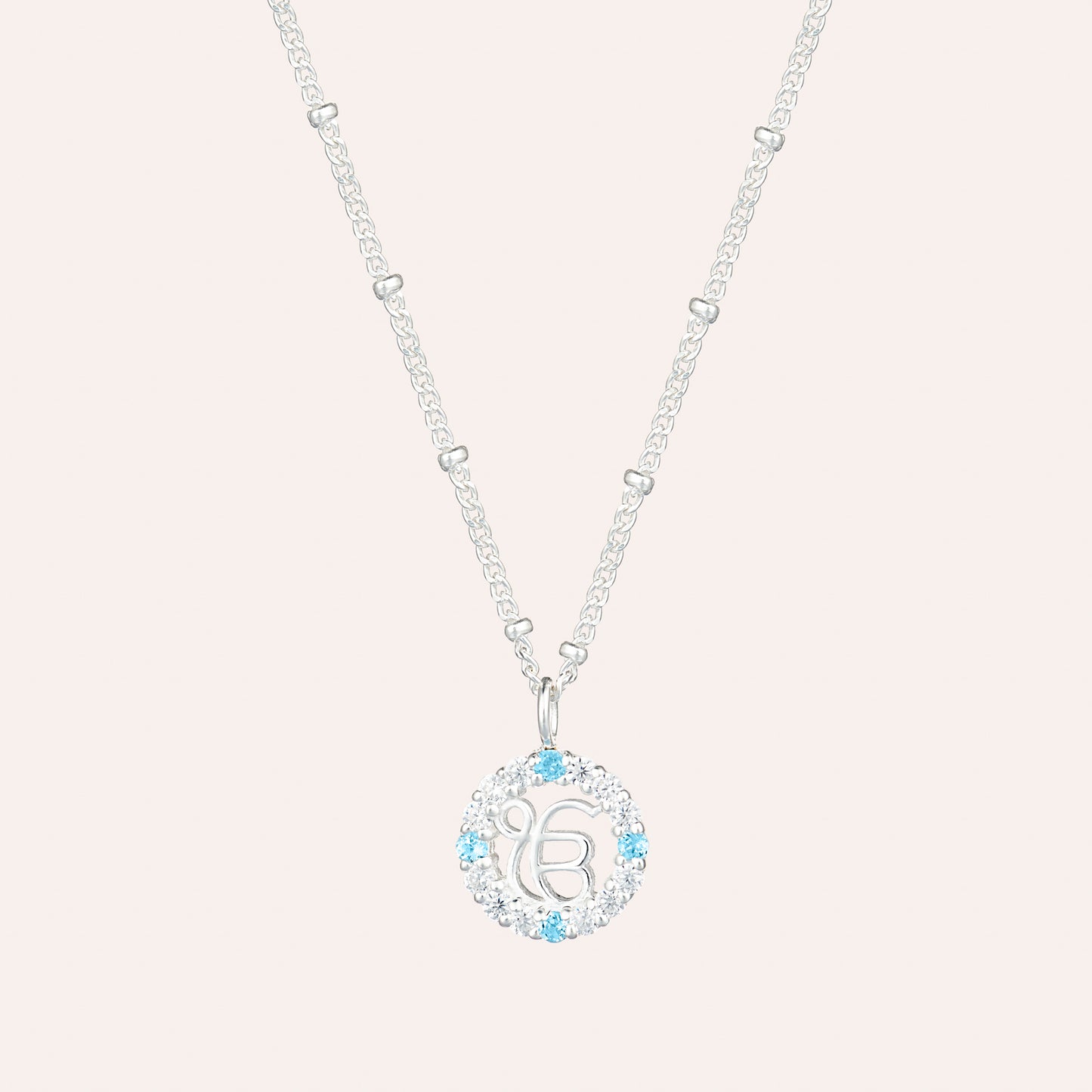 Circle of Light Necklace with Blue Topaz and Cubic Zirconia Pendant