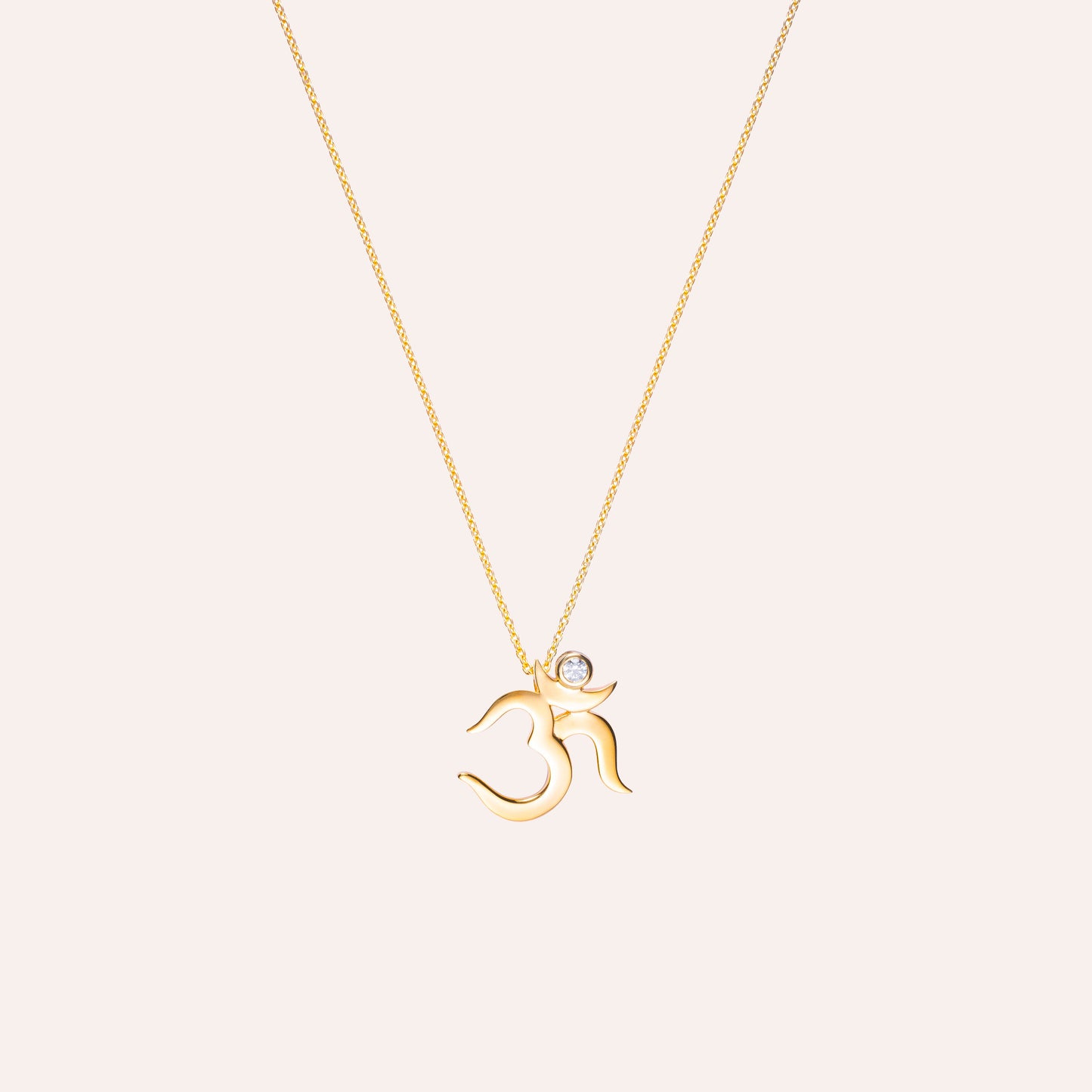 Dainty Gold Om pendant with cubic zirconia