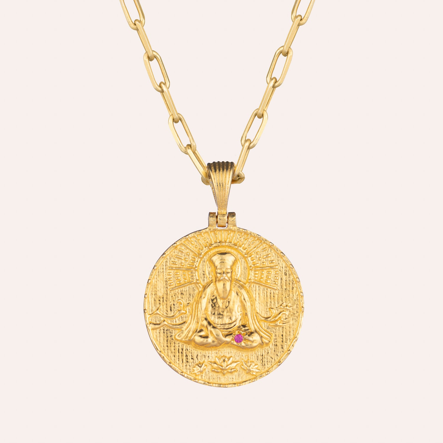 Guru Nanak Coin necklace in sterling silver with 22K gold Vermeil features a small ruby in the right foot . Has a stylish rectangular link adjustable chain . The reverse side of the coin design features the ancient  mantra Satnam , Waheguru and Ik Onakar symbol is 25mm in diameter.
