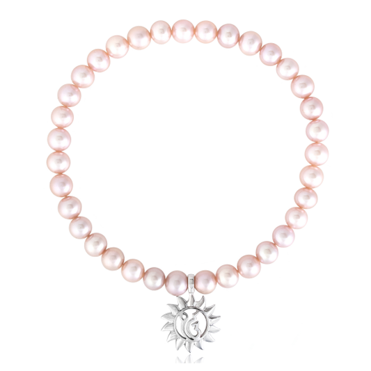 Finest quality string of baby pink cultured freshwater pearls with a 13mm sterling silver charm featuring the ik Oankar symbol meaning one divine creator.