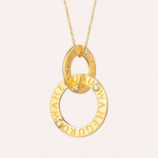 Sohavi Infinity necklace has mantra Satnam meaning eternal truth, Waheguru meaning oh wow wondrous universe and cubic zirconia with chain . Sterling silver with 22K gold Vermeil .